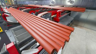 Steel tubes undergoing anti-rust coating at Royal Van Leeuwen using in-house and partner solutions